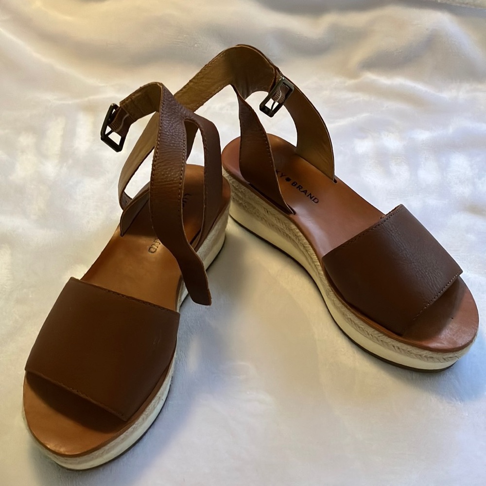 Lucky brand size 8.5 sandal 2” wedge brown leather. Never worn!